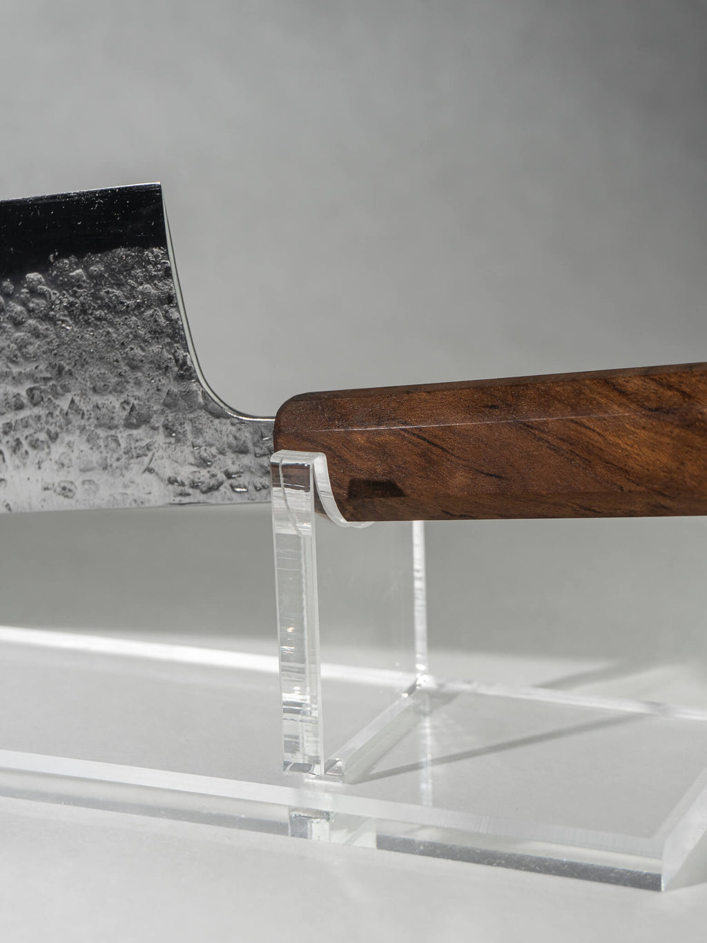 Close-up of Nakiri knife choil area showing smooth transition from handle to recycled leaf spring steel blade.