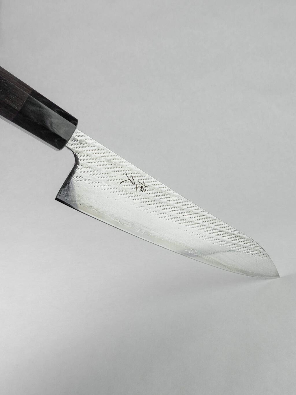 Tsunehisa Ginsan Gyuto knife blade profile view featuring the sharp tip.